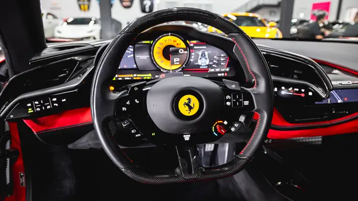Red on red Ferrari SF90 rental dashboard view - mph club