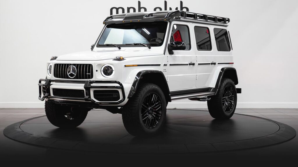 White Mercedes Benz AMG G63 4x4 SUV rental profile view - mph club