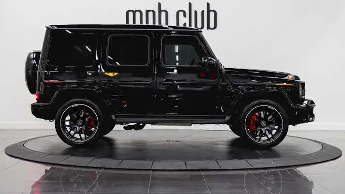 Black on red Mercedes Benz G63 rental side view - mph club