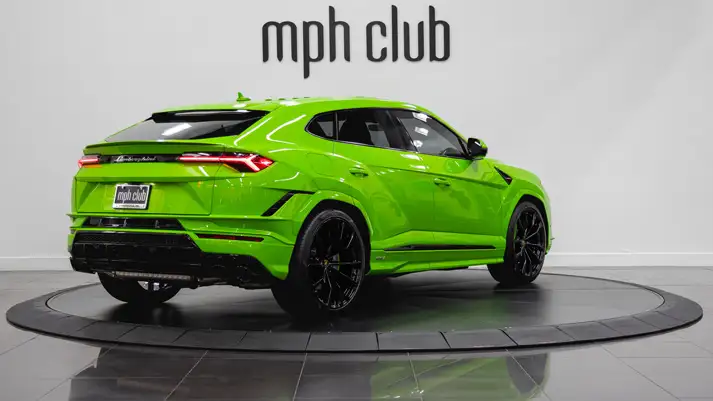 Green Lamborghini Urus S rental rear view - mph club