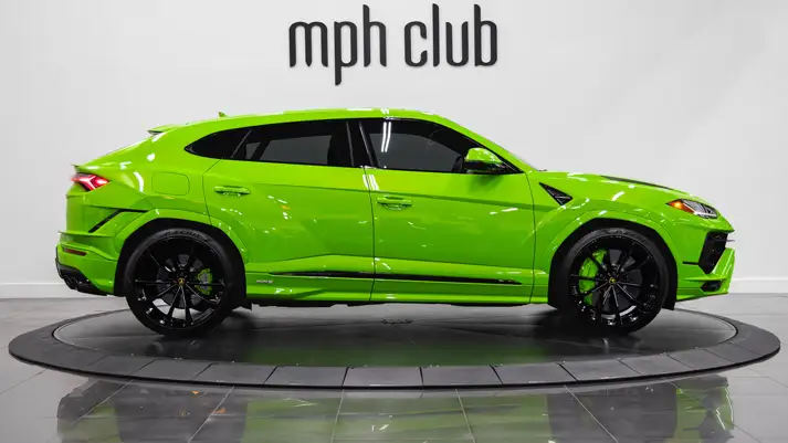 Green Lamborghini Urus S rental side view - mph club