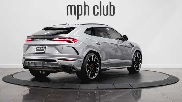 Grey on grey Lamborghini Urus rental rear view - mph club