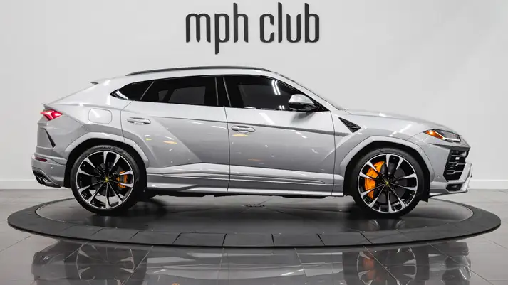 Grey on grey Lamborghini Urus rental side view - mph club