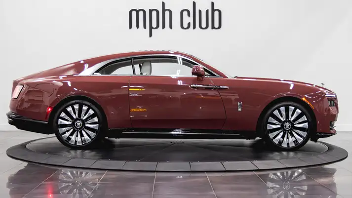Pink Rolls Royce Spectre rental side view - mph club