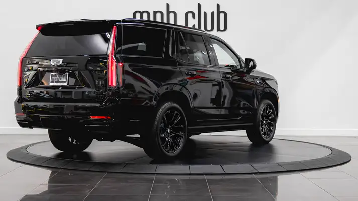 Black Cadillac Escalade Sport rental rear view - mph club