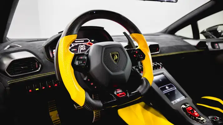 Black Lamborghini Huracan STO rental dashboard view - mph club