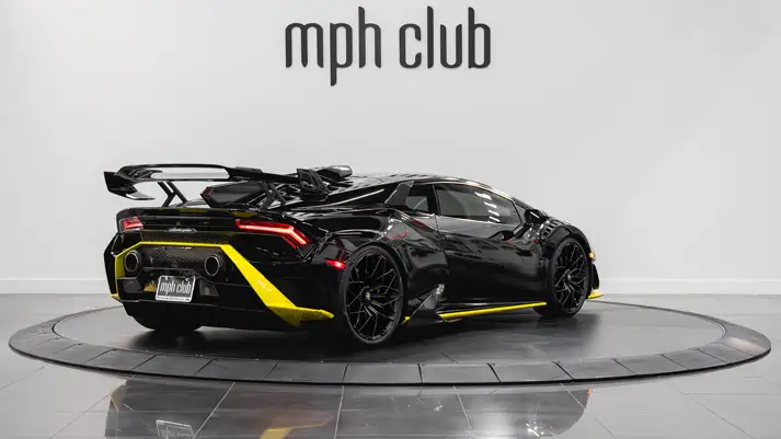 Black Lamborghini Huracan STO rental rear view - mph club