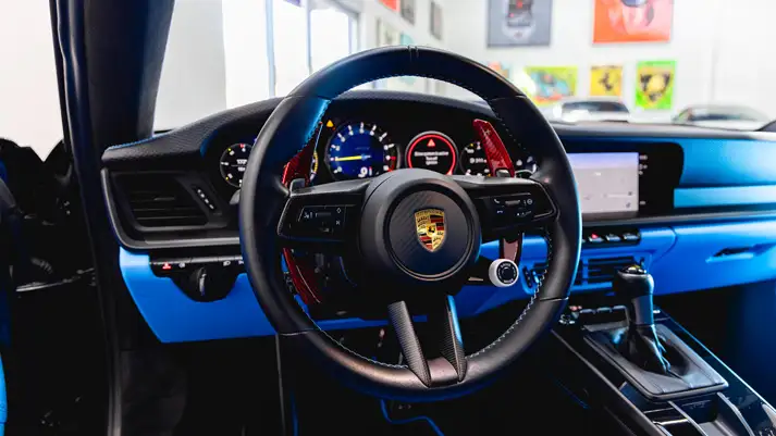 Black Porsche 911 GT3 rental dashboard view - mph club