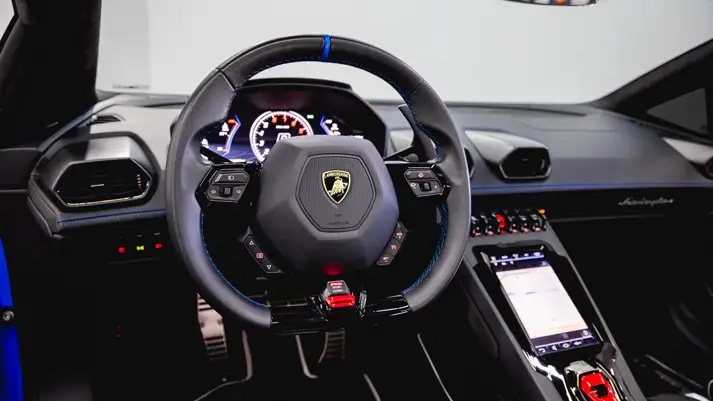 Blue on black Lamborghini Huracan EVO Spyder rental dashboard view - mph club