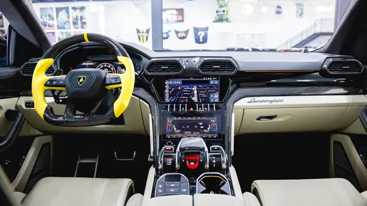 Blue on white Lamborghini Urus rental dashboard view - mph club