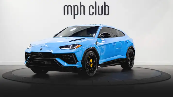 Blue on white Lamborghini Urus rental profile view rszd - mph club