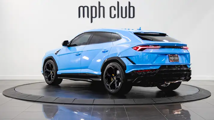 Blue on white Lamborghini Urus rental rear view - mph club