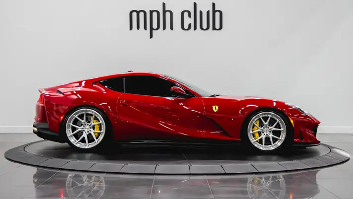 Red on black Ferrari 812 Superfast rental side view - mph club