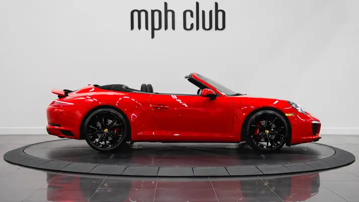 Red Porsche 911 Carrera Cabriolet rental side view - mph club