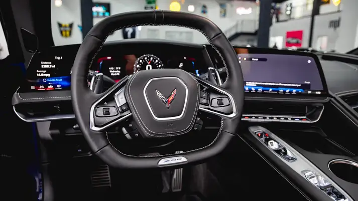 Blue Chevrolet Corvette Z06 rental dashboard view - mph club