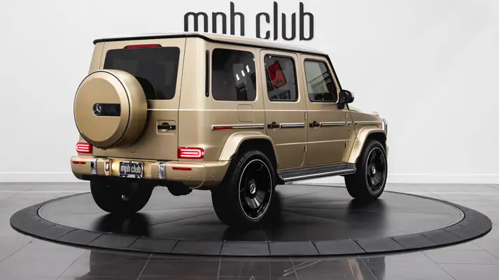 Gold Mercedes Benz G 550 rental rear view - mph club