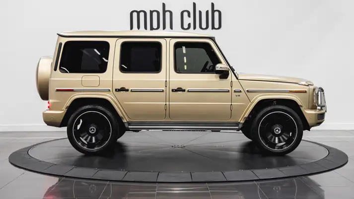 Gold Mercedes Benz G 550 rental side view - mph club