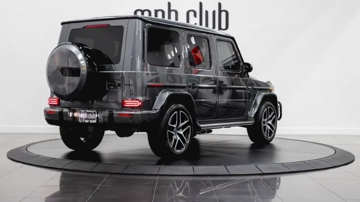 Grey Mercedes Benz AMG G63 SUV rental rear view - mph club