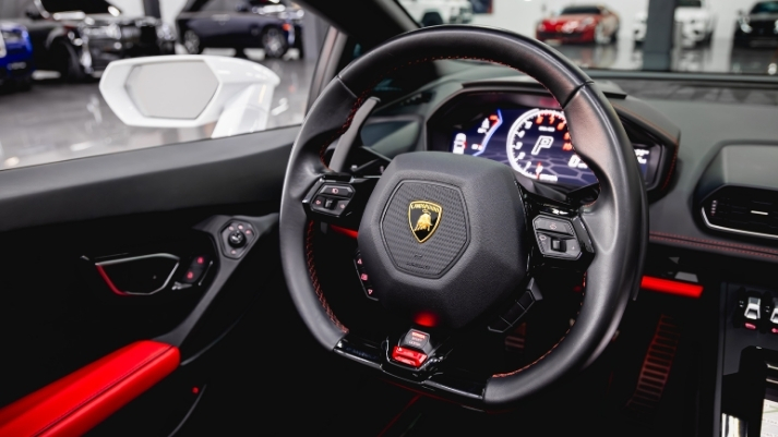 White and black Lamborghini Huracan EVO Spyder rental dashboard view - mph club