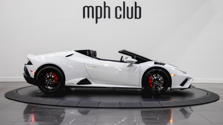 White and black Lamborghini Huracan EVO Spyder rental side view - mph club