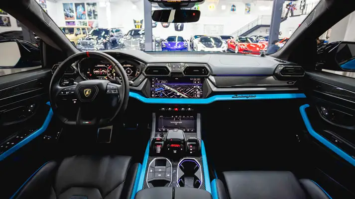 Blue Lamborghini Urus SE rental dashboard view - mph club