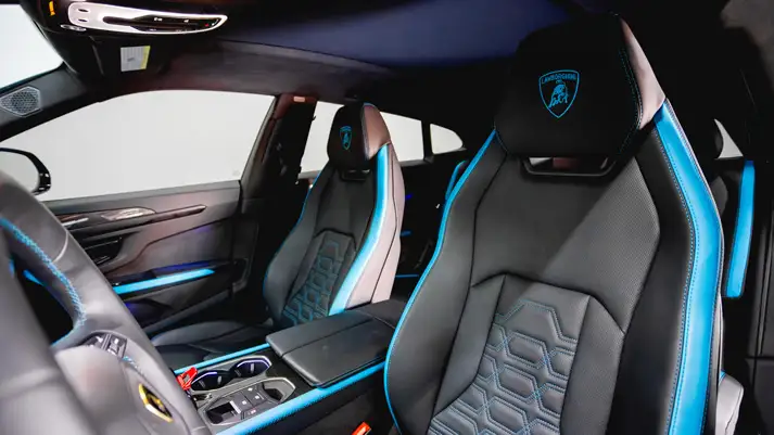 Blue Lamborghini Urus SE rental interior view - mph club
