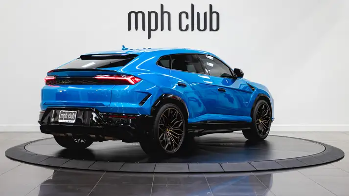 Blue Lamborghini Urus SE rental rear view - mph club