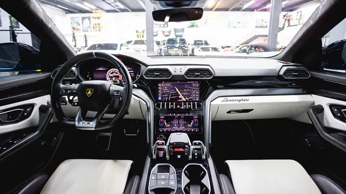 light-blue-on-white-lamborghini-urus-rental-dashboard-view-mph-club