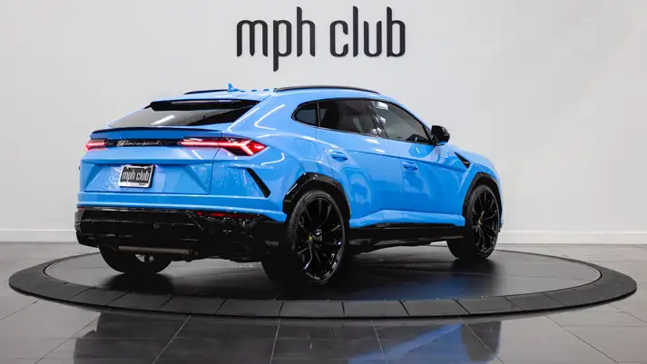 light-blue-on-white-lamborghini-urus-rental-rear-view-mph-club