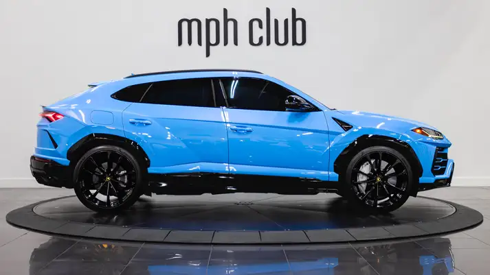 light-blue-on-white-lamborghini-urus-rental-side-view-mph-club