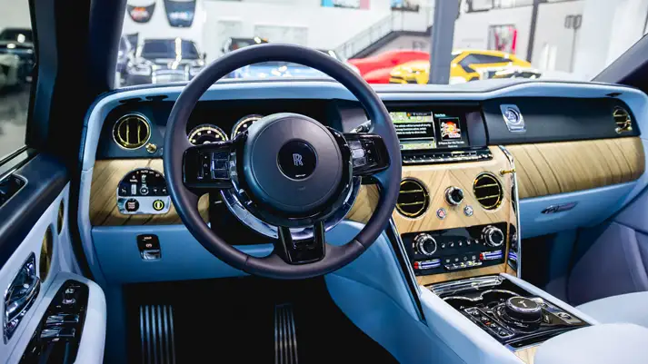 White on light blue Rolls Royce Cullinan rental dashboard view - mph club
