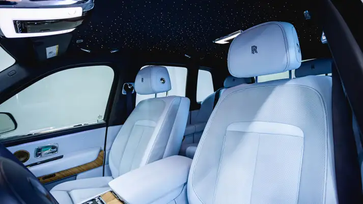 White on light blue Rolls Royce Cullinan rental interior view - mph club