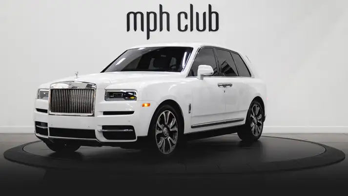 White on light blue Rolls Royce Cullinan rental profile view rszd - mph club