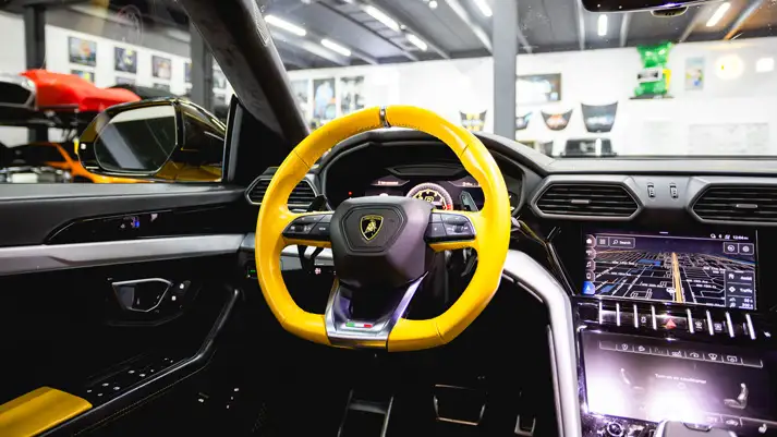 Yellow Lamborghini Urus with stars rental dashboard view - mph club