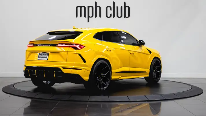 Yellow Lamborghini Urus with stars rental rear view - mph club