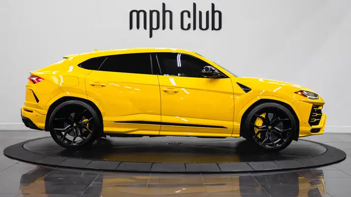 Yellow Lamborghini Urus with stars rental side view - mph club