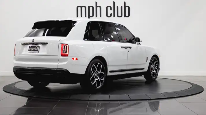 White on black Rolls Royce Cullinan rental rear view - mph club