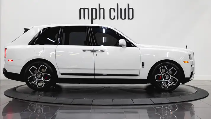 White on black Rolls Royce Cullinan rental side view - mph club
