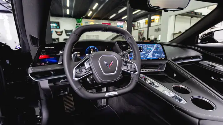 Black on black Chevrolet Corvette Z06 rental dashboard view - mph club