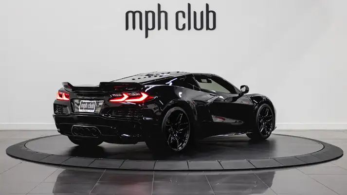 Black on black Chevrolet Corvette Z06 rental rear view - mph club