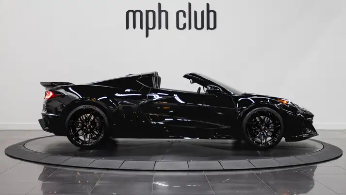 Black on black Chevrolet Corvette Z06 rental side view - mph club